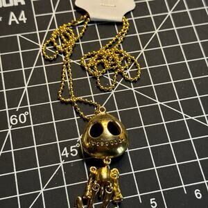 Gold tone dangle alien, skeleton pendant necklace.  Gothic punk emo